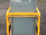 a large metal container sitting on a cart in a parking lot