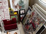 a pile of art on the floor next to a radiator