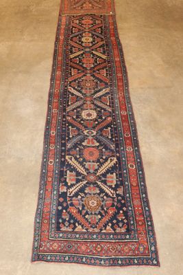 a long rug on the floor in a room