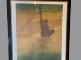 an image of a picture of a statue of liberty floating in the water