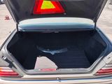 a trunk of a car with a warning sign in the trunk