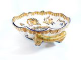 a bowl with a handle that has a design on it