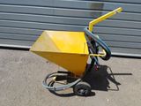 a small yellow machine with a hose attached to it