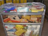 a cart with many items in it in a warehouse