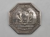 an image of a silver coin with a picture of a lion on it