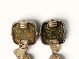 pair of gold tone earrings with green and white stones and pearls