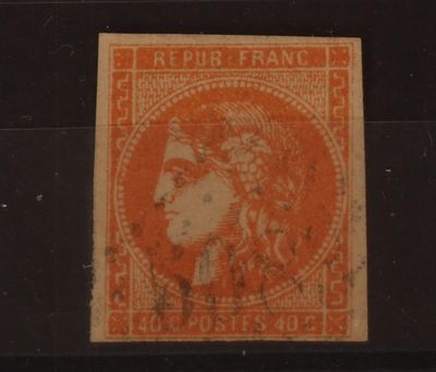 un timbre orange sur lequel figure l'image d'une femme