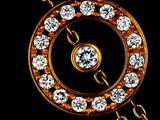 a gold and diamond necklace with chains on a black background