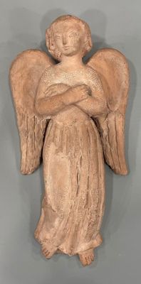 an image of a statue of an angel holding a baby