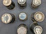 six empty beer cans are arranged in a circle on a table