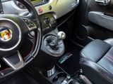 a steering wheel and dashboard of a small car