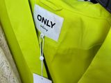 a lot of clothes on a rack in the store