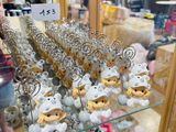 a lot of stuffed animals on display in a glass case
