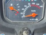 a close up of a speedometer on a motorcycle