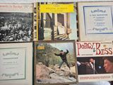a lot of music books on the table together