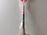 a baseball bat that is wrapped in plastic and sitting on a table