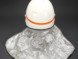 a close up of a white hat with an orange band on it