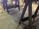 a table that is made out of wood and has a bench underneath it