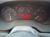a close up of a car dashboard with a speedometer