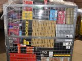 a metal cart with many items on it in a warehouse