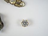 three pieces of jewelry including a ring, broochle, and a broochle