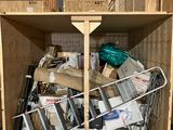 a wooden box filled with assorted items in a warehouse