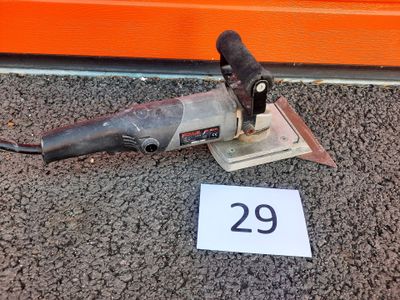 a picture of a drill on the ground next to a number 29