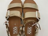 a pair of women ' s sandals on a white surface