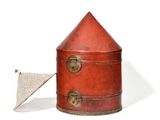 a small red box with a flag on top of it