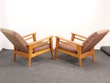 two chairs sitting next to each other in a room