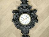 a clock that is on the wall on the floor
