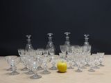 a lot of empty wine glasses and an apple on the table