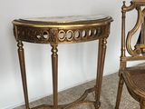 two chairs and a table in the corner of a room