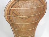 an image of a wicker chair sitting on top of a white surface