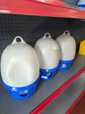 four empty plastic containers on a shelf in a store