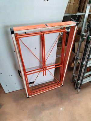 a picture of a room with a ladder and a cabinet