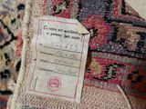 a label on the back of a rug with a price tag on it
