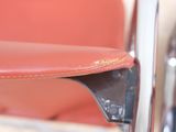 a close up view of a chair with a leather seat