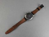 an image of a wrist watch with a brown leather band