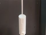 a white and gray vacuum on a table