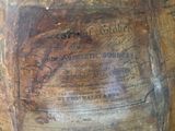 a large wooden bowl sitting on top of a wooden table