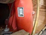 a red blower sitting on top of a wooden table
