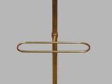 an image of a brass and black umbrella stand on a gray background