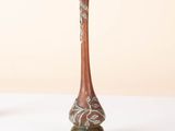 two vases that are sitting on a white table