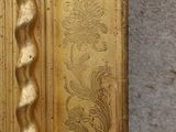 a gold door with a decorative design on it