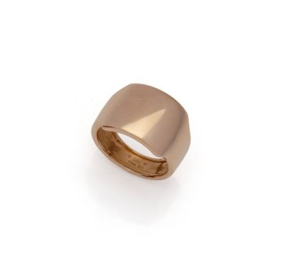 a close up of a gold ring on a white background