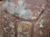 a rusted metal container sitting on a table