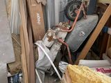 a pile of junk in a room with a lot of stuff