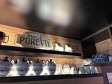 a display of teapots on a shelf in a restaurant
