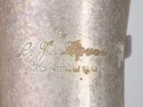 a silver vase that has a label on it